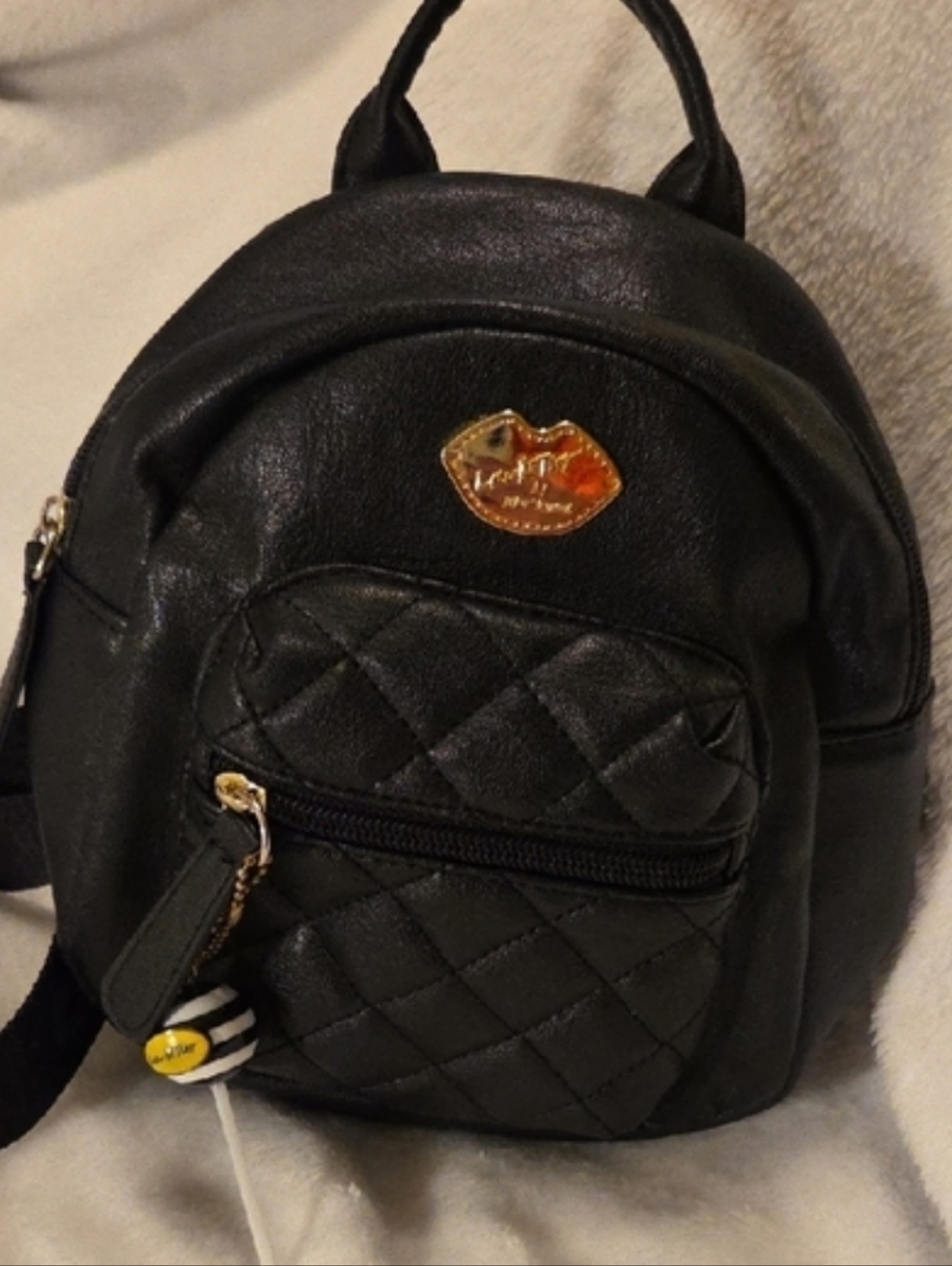 EUC: Black Quilted Mini Backpack with Gold Lollipop Accent